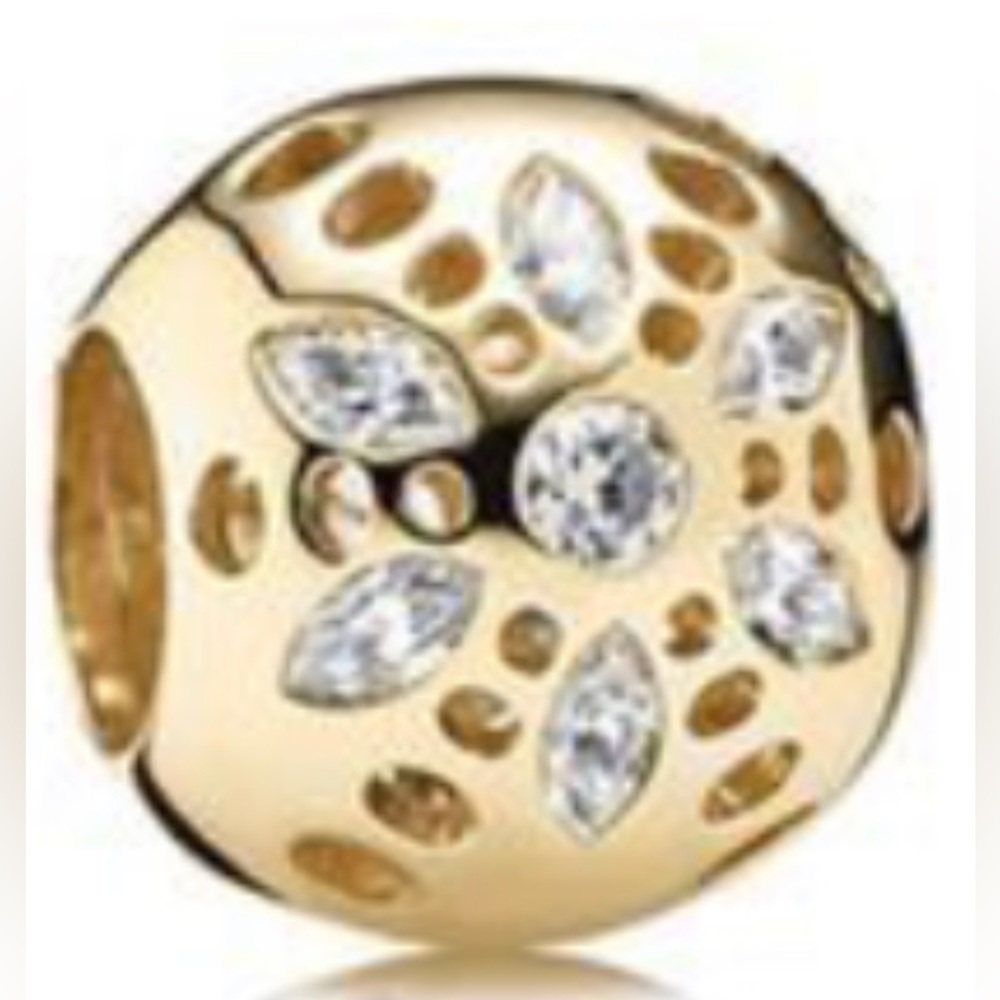 Retired authentic 14K yellow gold Pandora sparkly blossom charm.